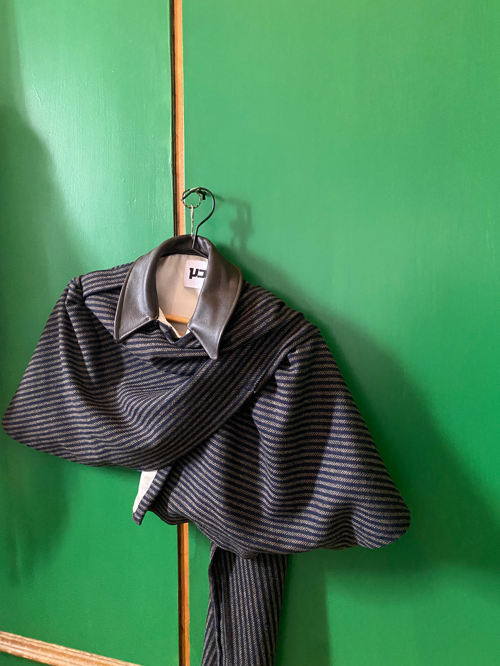The wool & leather mini cape